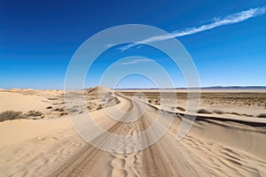 scenic road trip through the desert, with endless sand dunes and blue skies