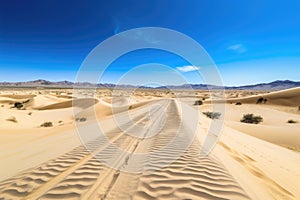 scenic road trip through the desert, with endless sand dunes and clear blue skies