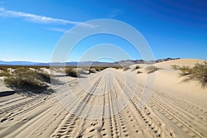 scenic road trip through a desert landscape, with endless sand dunes and clear blue skies