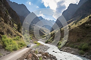 scenic road trip through the mountains, with towering peaks and rushing rivers