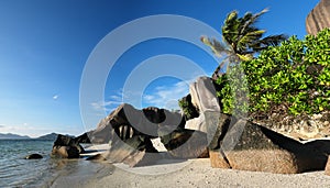 Scenic  rocks and palm trees at Anse Source d`Argent beach  on the La Digue island, Seychelles