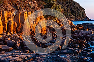 Scenic rocky beach Cala Violina landscape at the sunset. Tyrrhenian Sea bay at the sunset