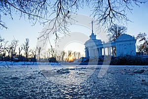 Scenic russian winter wonderland sunset view of non frozen river with trees scenery reflections on water panoramic wide