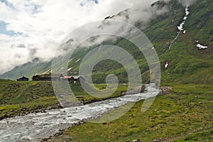 Scenic scandinavian house in green landscape of Norway