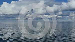 Scenic seascape with White cumulus clouds