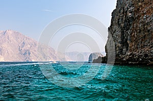 Scenic seaside surrounded by desert rocks in Khasab Oman