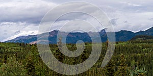 Scenic shot of the Alaska Range in the Southcentral region of Alaska, USA under a cloudy sky photo