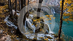 Scenic shot of a beautiful waterfall flowing into a lake in Plitvice Lakes National Park, Croatia