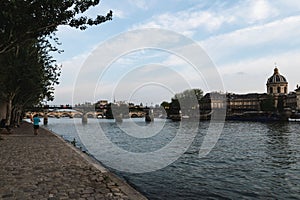 Scenic shot of the Bridge of Arts over the Seine and the Institute of France on its bank