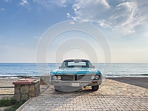 Scenic shot of a classic car parked on the beach