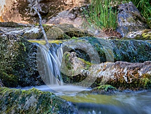 Scenic shot of the flow of a rocky river with a silky water effect