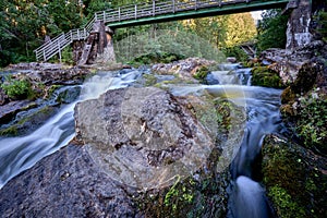 Scenic shot of the flow of a rocky river with a silky water effect