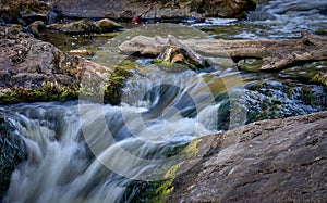 Scenic shot of the flow of a rocky river with a silky water effect