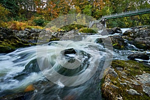 Scenic shot of the flow of a rocky river with a silky water effect