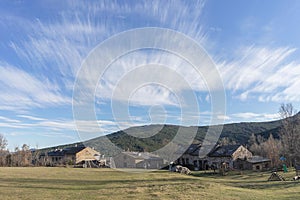 Scenic shot of grass fields and stone houses from the village of Valverde de Los Arroyos, Spain photo