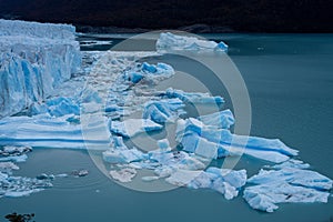Scenic shot of a massive blue iceberg floating in Argentino Lake