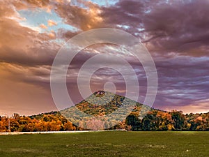 Scenic shot of Pinnacle Mountain in Pulaski County, Arkansas at pinky sunset