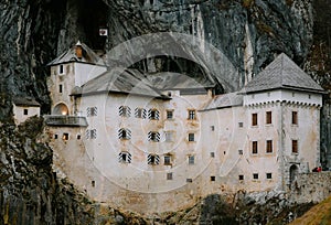 Scenic shot of Predjama Caste in a cave, winter time, Slovenia