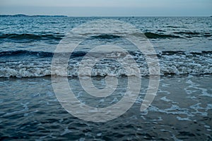 Scenic shot of waves at Revere Beach in Revere, Massachusetts during dusk