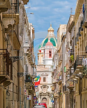 Scenic sight in Trapani with the Church of Saint Francis of Assisi in the background. Sicily, Italy.