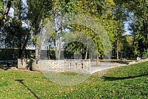 Scenic small brick wall and picnic area in Bundek city park, Zagreb, Croatia