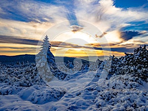 Scenic snowy landscape with a view from a mounatin range to the valley