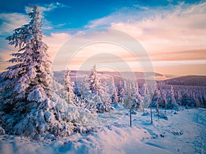 Scenic snowy landscape with a view from a mounatin range to the valley