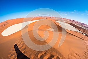 The scenic Sossusvlei and Deadvlei, clay and salt pan surrounded by majestic sand dunes. Namib Naukluft National Park, travel dest