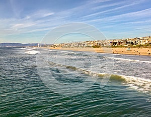 Scenic Southern California with beachfront homes on the Strand and waves rolling in