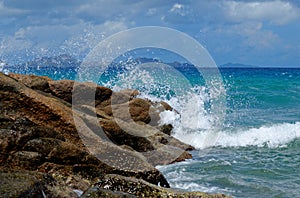 Scenic splashes of surf at Anse Severe beach on La Digue island, Seychelles