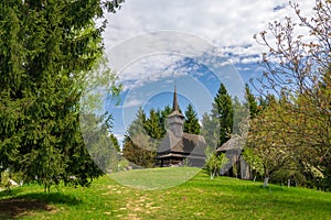 Scenic spring rural landscape with traditional maramures neo-gothic church, Maramures, Romania