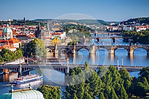 Scenic spring sunset aerial view of the Old Town pier architecture and Charles Bridge over Vltava river in Prague, Czech Republic