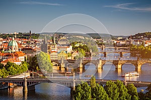 Scenic spring sunset aerial view of the Old Town pier architecture and Charles Bridge over Vltava river in Prague, Czech Republic