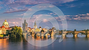 Scenic spring sunset aerial view of the Old Town pier architecture and Charles Bridge over Vltava river in Prague, Czech Republic