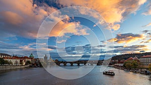 Scenic spring sunset aerial view of the Old Town pier architecture and Charles Bridge over Vltava river in Prague, Czech Republic