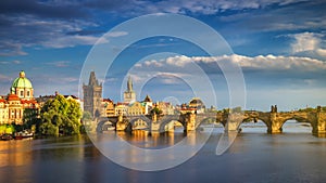 Scenic spring sunset aerial view of the Old Town pier architecture and Charles Bridge over Vltava river in Prague, Czech Republic