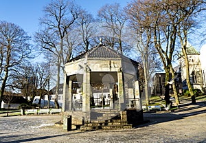 A scenic stone gazebo and seagulls around it in Stavanger city park