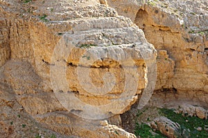 Scenic stratified orange rock on the cliff