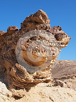 Scenic stratified orange rock in stone desert, Isr