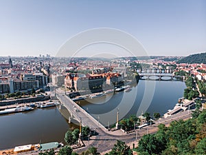 Scenic summer sunrise aerial view of the Old Town pier architecture and Charles Bridge over Vltava river in Prague, Czech Republic