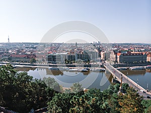 Scenic summer sunrise aerial view of the Old Town pier architecture and Charles Bridge over Vltava river in Prague, Czech Republic