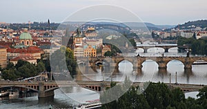 Scenic summer sunset aerial view of the Prague Old Town pier architecture and Charles Bridge over Vltava river in Prague, Czech