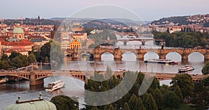 Scenic summer sunset aerial view of the Prague Old Town pier architecture and Charles Bridge over Vltava river in Prague, Czech