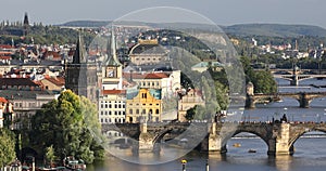 Scenic summer sunset aerial view of the Prague Old Town pier architecture and Charles Bridge over Vltava river in Prague, Czech