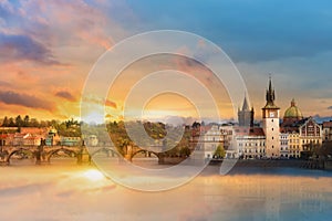 Scenic summer view of the Old Town buildings, Charles bridge and Vltava river in Prague during amazing sunset, Czech Republic