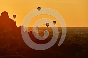 Scenic sunrise with many hot air balloons above Bagan in Myanmar