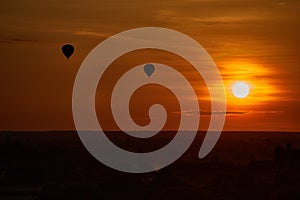 Scenic sunrise with many hot air balloons above Bagan in Myanmar