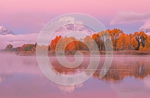 Scenic Sunrise Reflection of the Tetons in Autumn