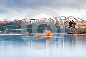 Scenic sunrise view of Lake Pukaki east bank, with their mesmerizing turquoise hue