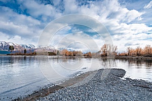 Scenic sunrise view of Lake Pukaki east bank, with their mesmerizing turquoise hue